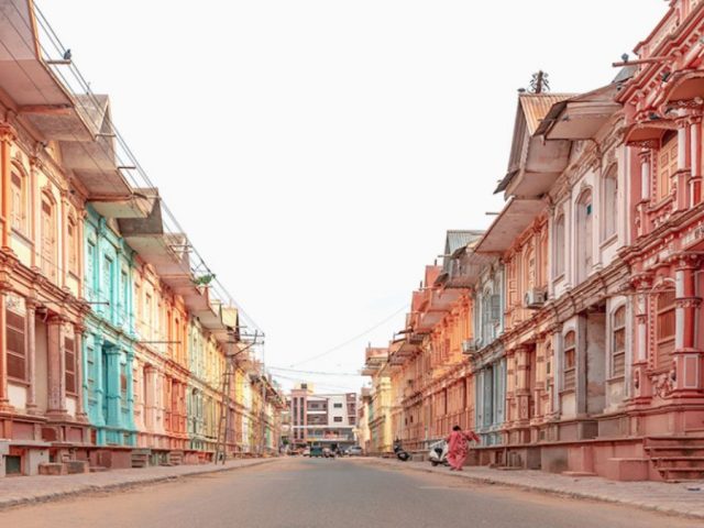 Pastel-colored century-old havelis lining a Bohra Vad heritage street in Sidhpur